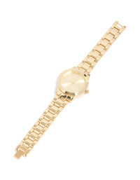 Crafted with roman numeral numbers gold dial round shape formal analog link-band strap gold plated statement watch for women front view - link has visual effect only