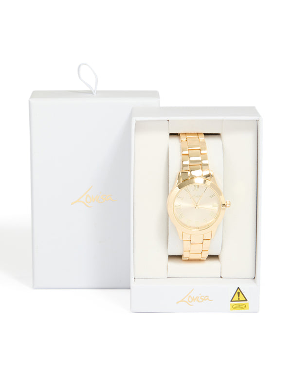 Designed with roman numeral numbers gold dial round shape formal analog link-band strap gold plated statement watch for women case detail view
