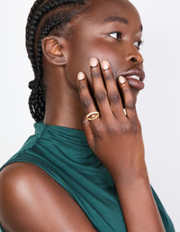 Showcasing a gold plated cubic zirconia split charm ring on finger view - link has visual effect only