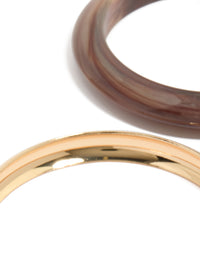 Showcasing gold and acrylic bangles 4-pack with brown detailing close up view - link has visual effect only