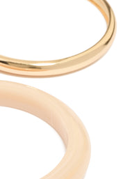 Showcasing gold and acrylic bangles 4-pack with brown detailing close up view - link has visual effect only