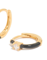 Showcasing gold plated sterling silver cubic zirconia and black enamel huggie earrings featuring hoop closure post detail view - link has visual effect only