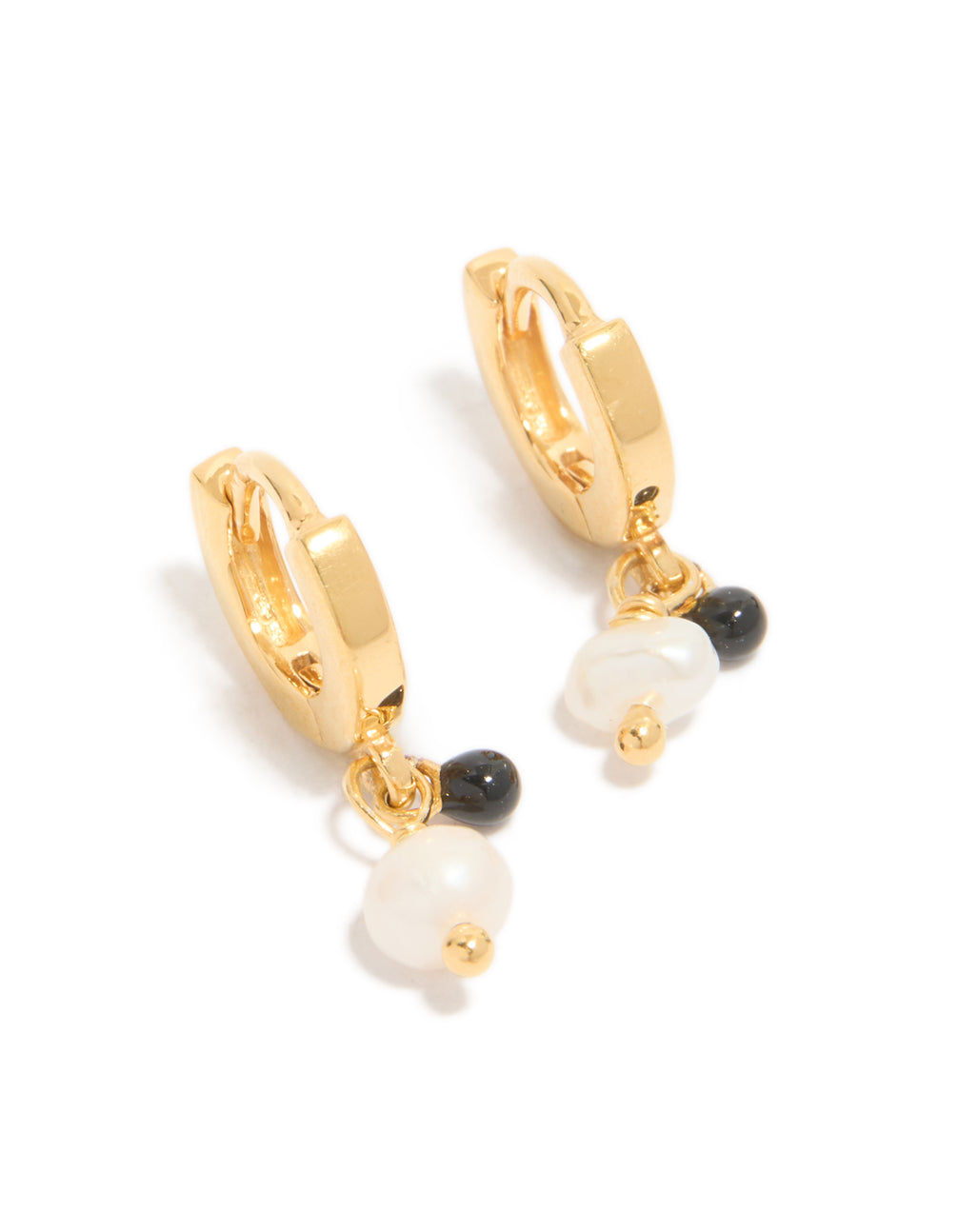 Showcasing gold plated sterling silver and pearl drop huggie earrings with huggie closure in ivory and black front view