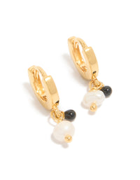 Showcasing gold plated sterling silver and pearl drop huggie earrings with huggie closure in ivory and black front view - link has visual effect only