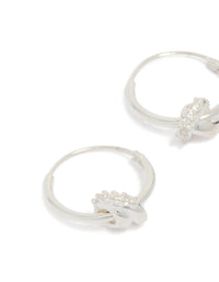Featuring sterling silver cubic zirconia knotted hoop earrings with detailed craftsmanship in close up view - link has visual effect only