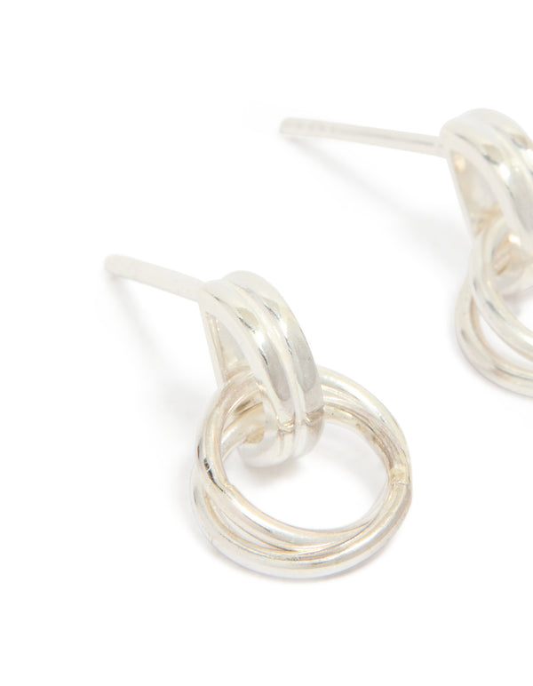 Featuring sterling silver doorknocker stud earrings with circular ring detail close up view