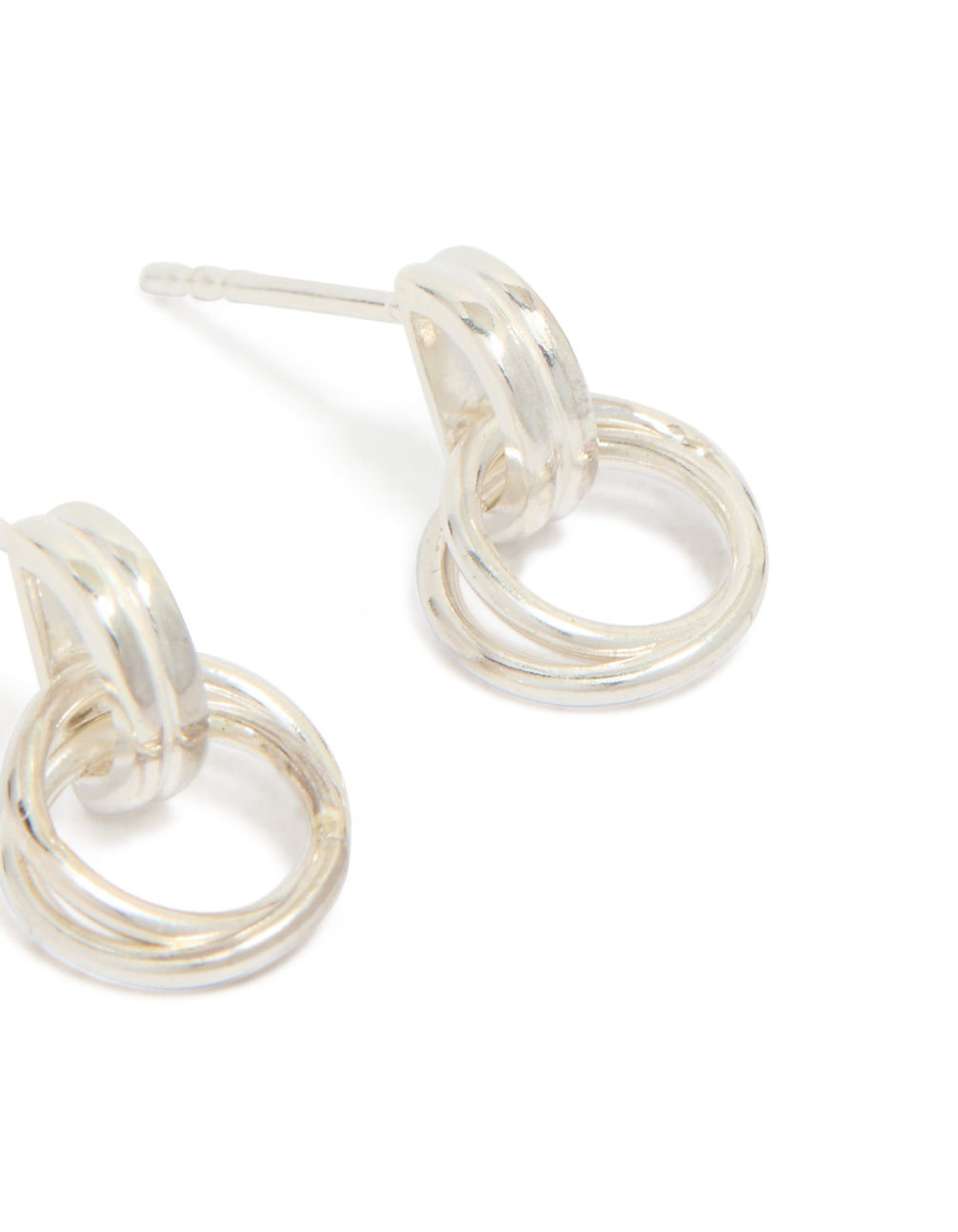 Crafted from sterling silver, these doorknocker stud earrings showcase interconnected rings and post closure detail view