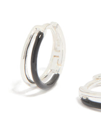 Featuring statement hoop earrings made from sterling silver with black enamel detail close up view - link has visual effect only