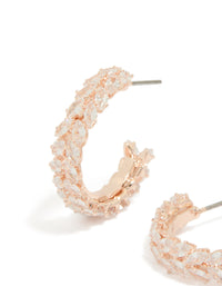 Detailed perspective of rose gold plated medium leaf hoop earrings featuring cubic zirconia close up view - link has visual effect only