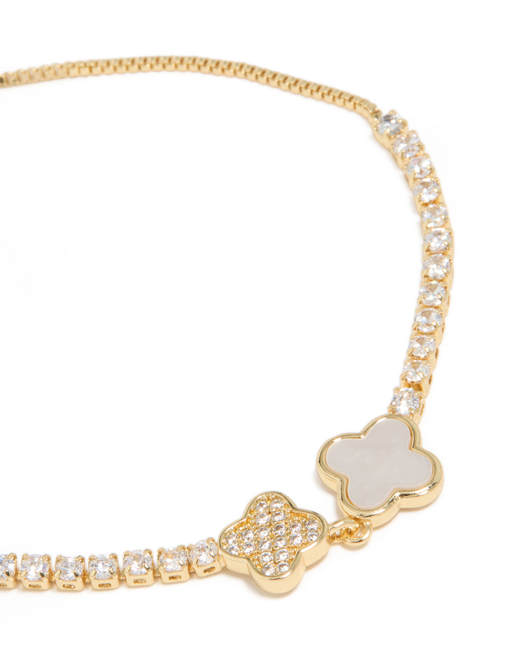 Showcasing a gold plated cubic zirconia double toggle bracelet featuring floral elements close up view