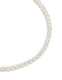 Crafted from silver plated material, this cubic zirconia small square tennis bracelet features glitter embellishments close up view - link has visual effect only