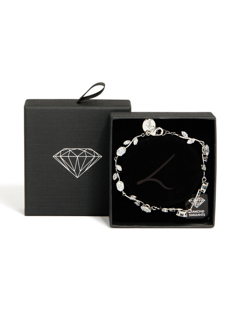 Detailed view of dainty vine bracelet featuring cubic zirconia stones in silver and clear with lobster clasp closure detail view