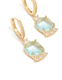 Beautifully crafted gold plated blue square cubic zirconia huggie earrings in aqua and clear stone close up view - link has visual effect only