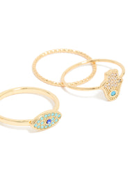 Crafted from gold plated cubic zirconia evil eye and hamsa hand rings 4-pack with celestial sun motifs, crystal accents, and statement style close up view - link has visual effect only