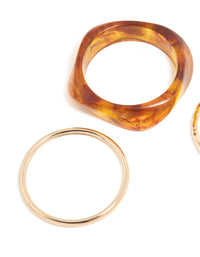 Crafted from gold and brown organic acrylic with orange tones bangle pack close up view - link has visual effect only