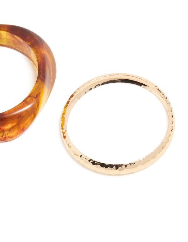 Crafted from gold and brown organic acrylic with orange tones bangle pack close up view