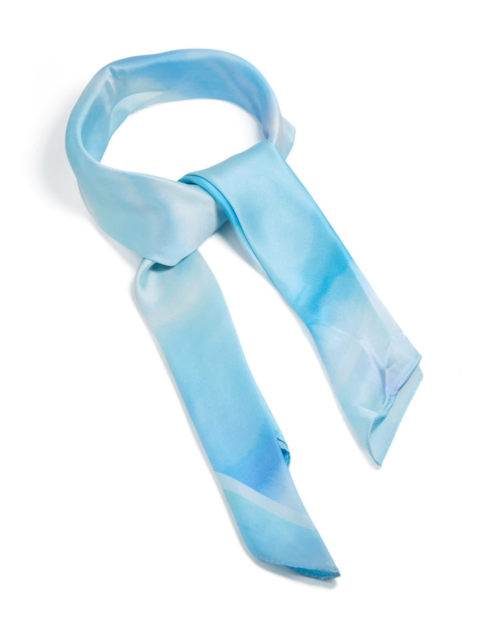 Showcasing a fabric scarf with tie-dye print in striped pattern and sky blue, powder blue, light blue, royal blue tones side view