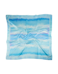 Discover a tie-dye striped fabric scarf in sky blue, powder blue, light blue, and royal blue shades front view - link has visual effect only