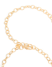 Crafted with embellished sun ,this gold statement waisted belt shown in a detail view - link has visual effect only