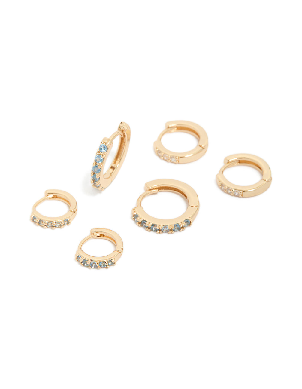 Stunning gold earrings in a 3-pack featuring clear and light blue cubic zirconia stones with huggie closure front view