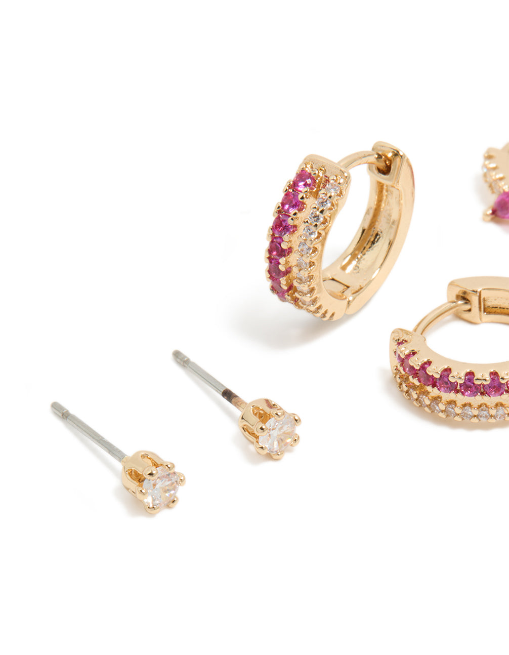 Showcasing gold hot pink cubic zirconia huggie and stud earrings in a 3-pack close view