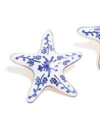 Crafted with painted starfish stud earrings showcasing floral and ocean details in white and blue close up view - link has visual effect only