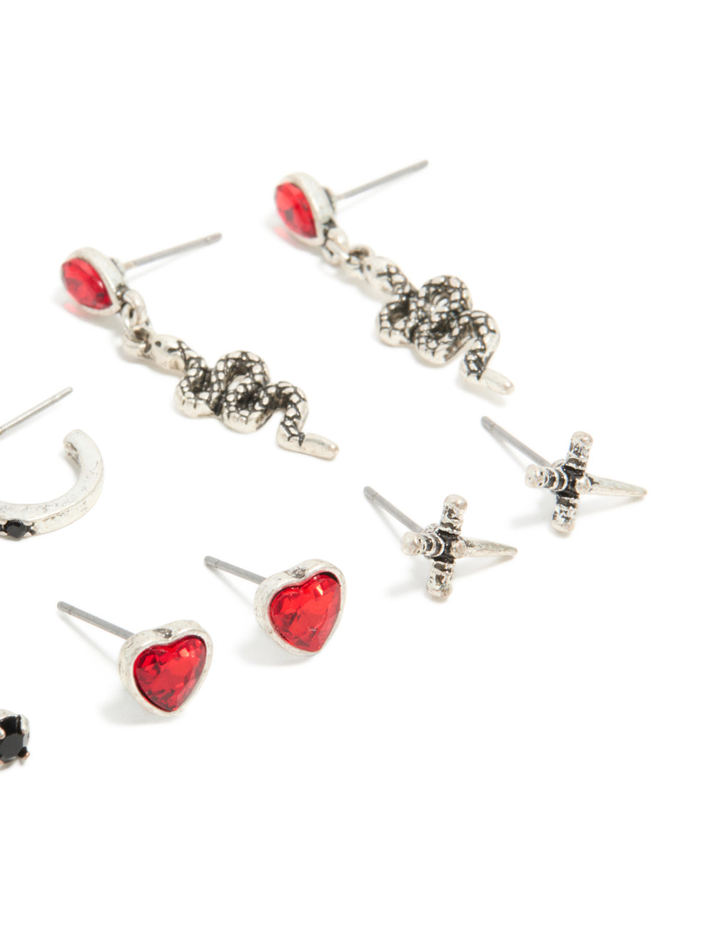 Sophisticated silver skull and crossbones earring pack with heart accents, snake motifs, cubic zirconia stones, hoop and stud closures, in red and black close up view