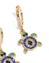 Elegant gold blue diamante turtle huggie earrings featuring ocean inspired design with turquoise and black accents in a post detail view - link has visual effect only