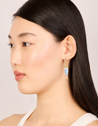 Featuring statement fish huggie earrings with a striped pattern and ocean theme, model view - link has visual effect only
