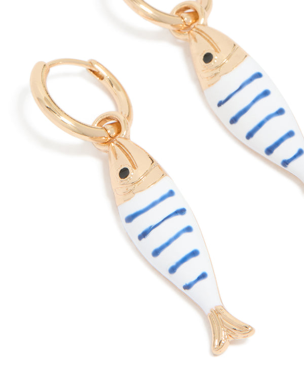 Crafted as statement fish huggie earrings with a striped pattern and ocean theme, close up view
