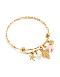 Beautifully designed waterproof stainless steel adjustable bangle featuring ocean-inspired starfish, shell, and freshwater pearl charms in gold plated finish front view - link has visual effect only