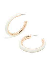 Showcasing statement hoop earrings in gold with ivory acrylic finish front view - link has visual effect only