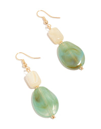 Showcasing statement drop earrings with beads in gold, ivory, and paleturquoise front view - link has visual effect only