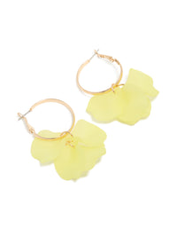Showcasing statement hoop earrings featuring charm with floral pattern in yellow and gold tones front view - link has visual effect only