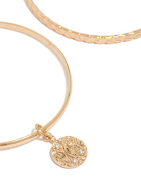 Highlighting the diamante textured bangle 2-pack in gold close up view - link has visual effect only