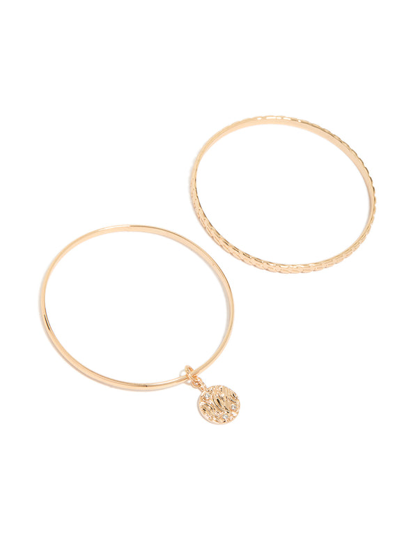 Designed with disc features in gold, this textured bangle 2-pack front view