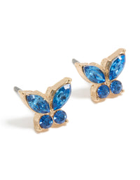 Showcasing dainty butterfly stud earrings in gold with blue diamante stones front view - link has visual effect only