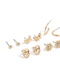 Showcasing gold diamante flower ,heart and butterfly design stud earrings 7-pack and stud closure close up view - link has visual effect only