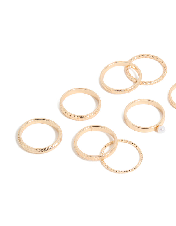 Featuring pearl accents and varied textures, this gold simple stackable statement ring 10-pack showcases intricate band designs close up view