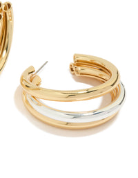 Showcasing statement large illusion hoop earrings in gold and silver plated metal post detail view - link has visual effect only