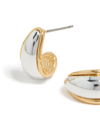 Highlighting mixed metal plated small teardrop drop earrings in silver and gold close up view - link has visual effect only
