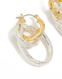 Featuring statement hoop earrings with mixed metal plated double link illusion design in gold and silver close up view - link has visual effect only