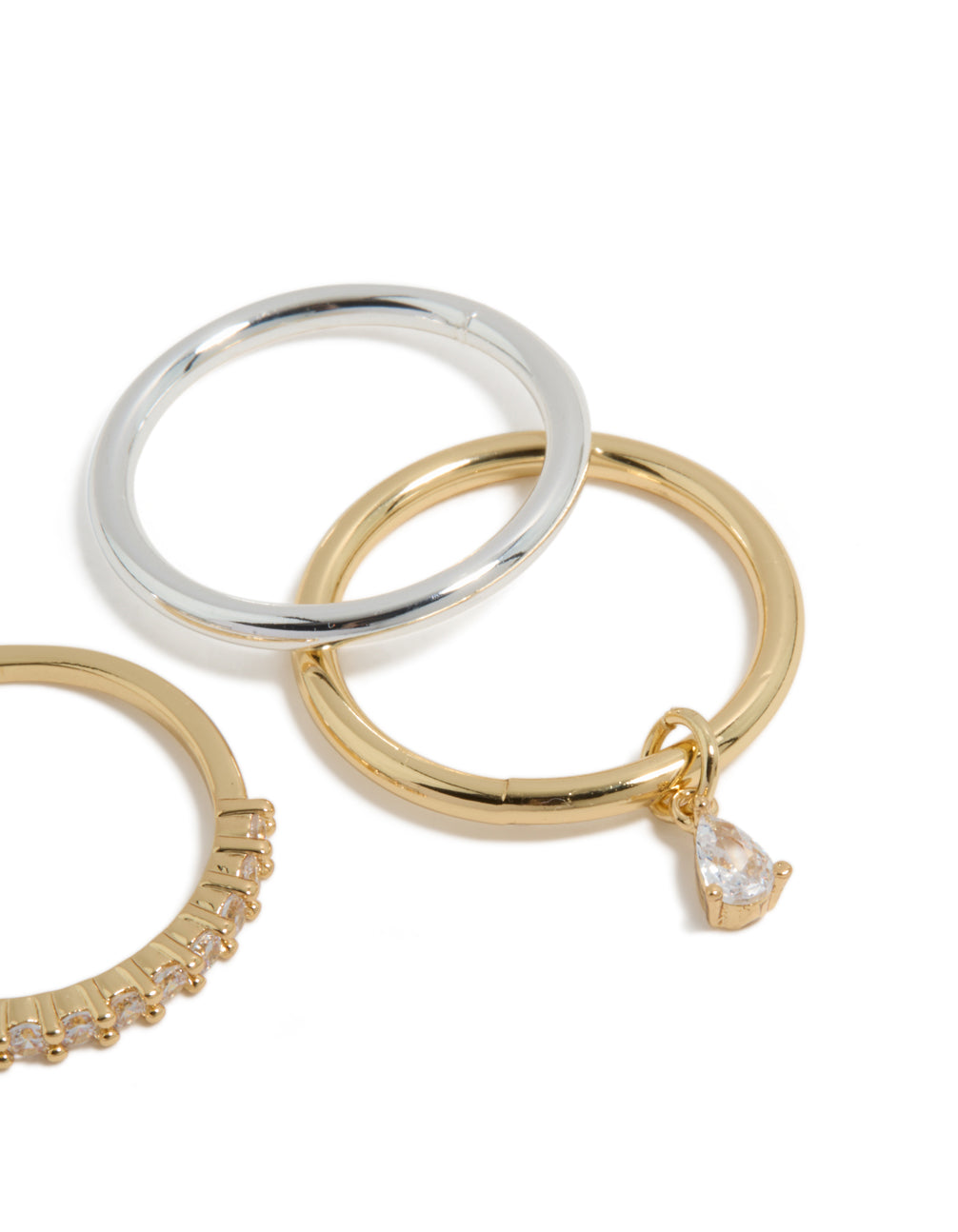 Crafted from mixed metal plated organic cubic zirconia rings 4-pack with charm in gold and silver tones side detail view