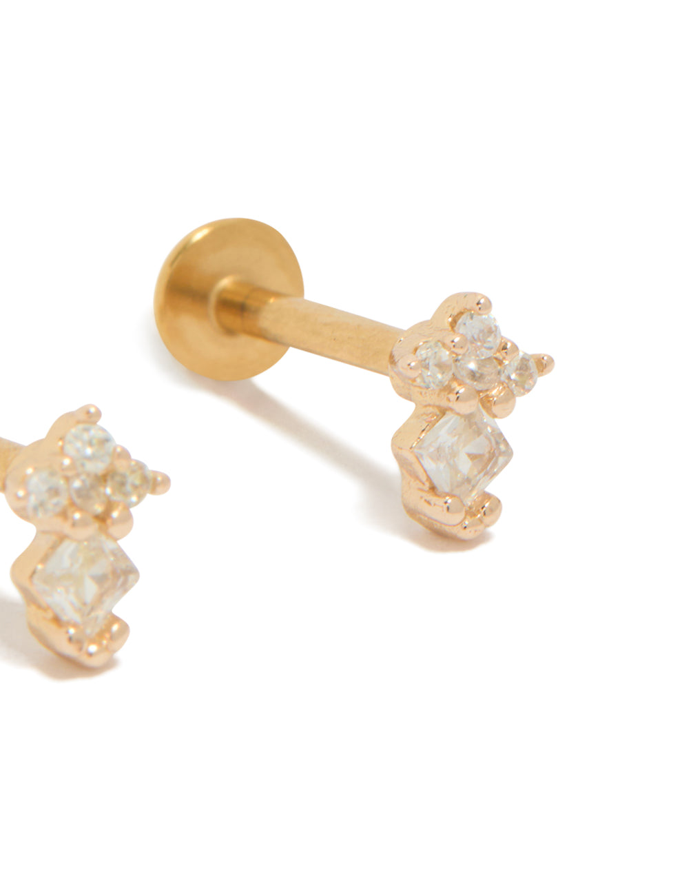 Elegantly designed mini stud earrings in surgical steel with cubic zirconia stones and flat back closure in gold plated finish close up view