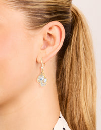 Featuring gold plated cubic zirconia cluster drop hook earrings with clear stones on ear view - link has visual effect only