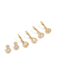 Showcasing gold plated cubic zirconia large bezel set studs and huggie earrings in a 3-pack front view - link has visual effect only