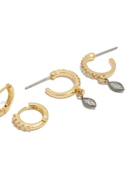 Discover mixed metal plated cubic zirconia bezel stud and huggie earrings in a 3-pack with gold, silver, and clear accents post detail view - link has visual effect only