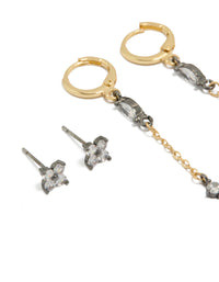 Crafted from plated materials with gold, silver and clear accents, these flower chain and huggie earrings are in a 3-pack set close up view - link has visual effect only