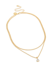 Discover this gold plated cubic zirconia teardrop pendant and ball layered necklace featuring crystal in dainty style front view - link has visual effect only