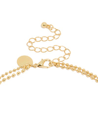 Presenting a gold plated cubic zirconia teardrop pendant and ball layered necklace featuring crystal in dainty style clasp detail view - link has visual effect only